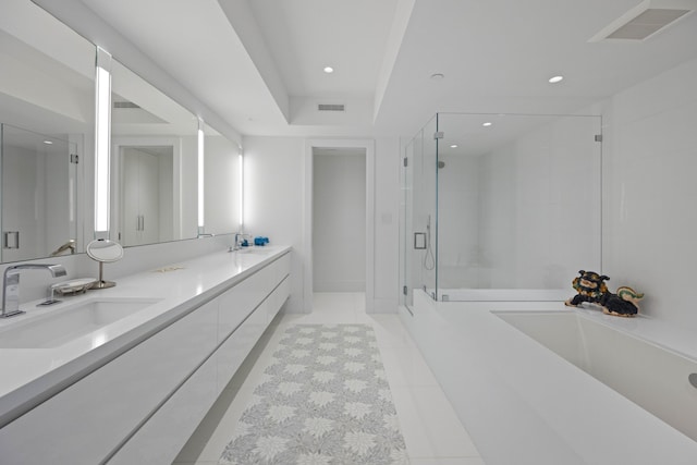 bathroom featuring vanity, tile patterned floors, and a shower with door