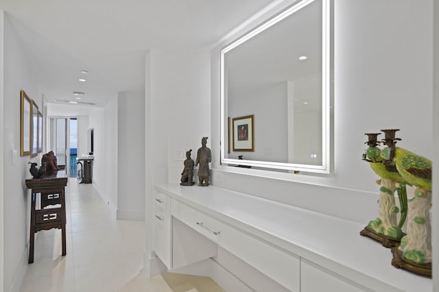 corridor featuring light tile patterned floors