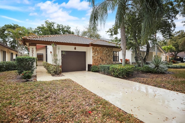 mediterranean / spanish-style house with a garage