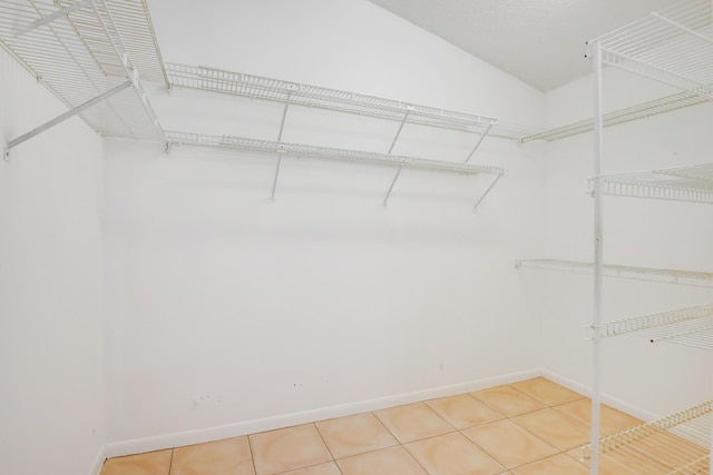 spacious closet with tile patterned flooring