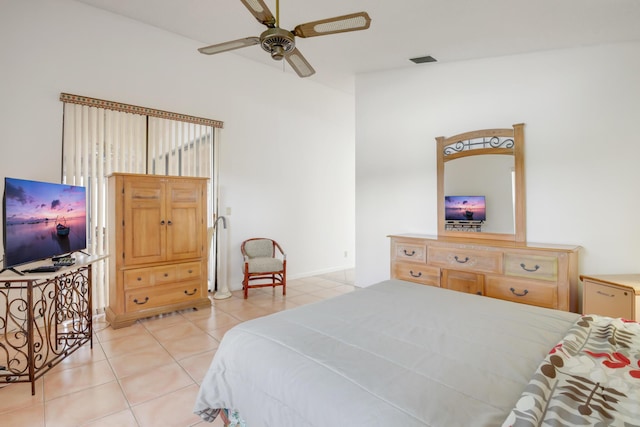 bedroom with ceiling fan and light tile patterned floors