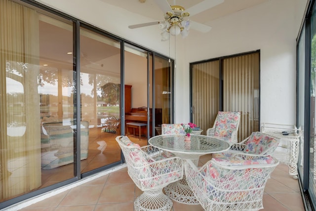 interior space with ceiling fan