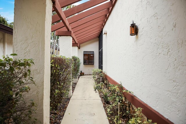 view of side of home featuring a pergola