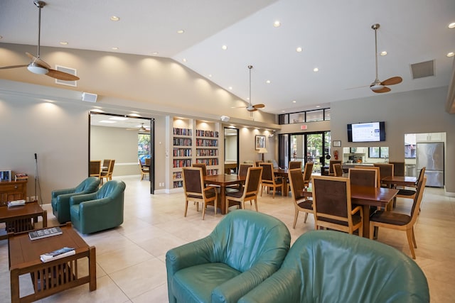 living room with ceiling fan, light tile patterned floors, built in features, and high vaulted ceiling