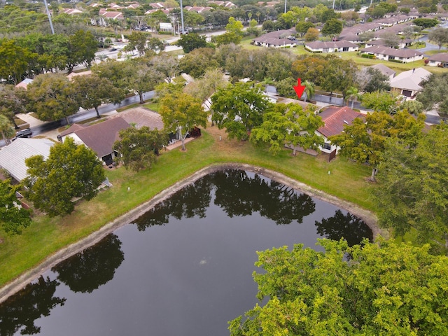 birds eye view of property featuring a water view and a residential view