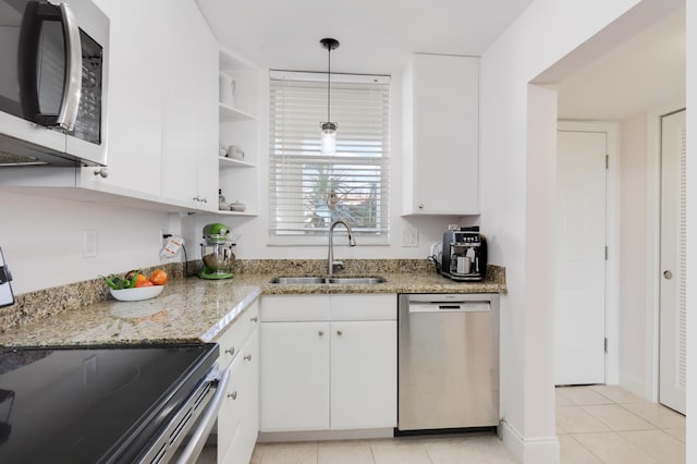 kitchen with appliances with stainless steel finishes, sink, and white cabinetry