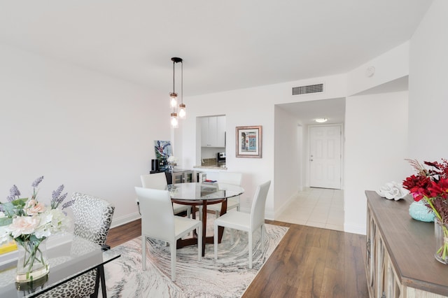 dining area with light wood-type flooring