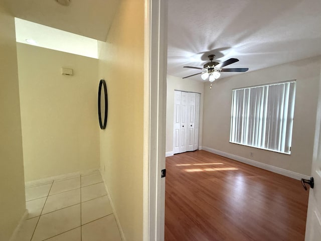 hallway with light tile patterned floors