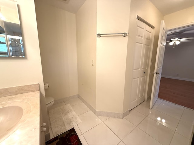 bathroom with ceiling fan, tile patterned floors, vanity, and toilet