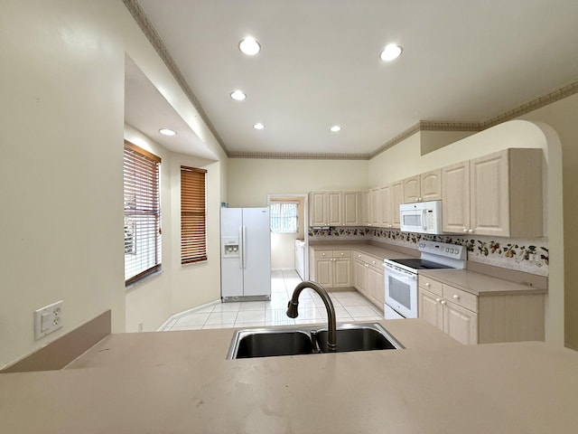 kitchen featuring tasteful backsplash, white appliances, light tile patterned flooring, crown molding, and sink