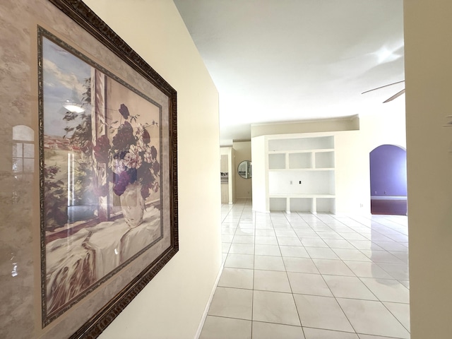 corridor featuring light tile patterned floors