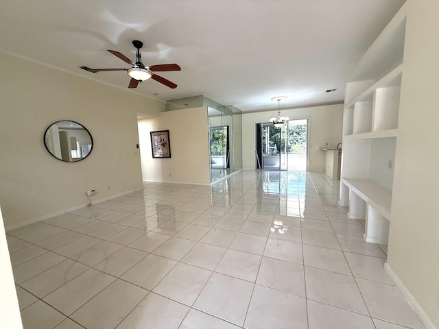 unfurnished room with light tile patterned floors and ceiling fan with notable chandelier