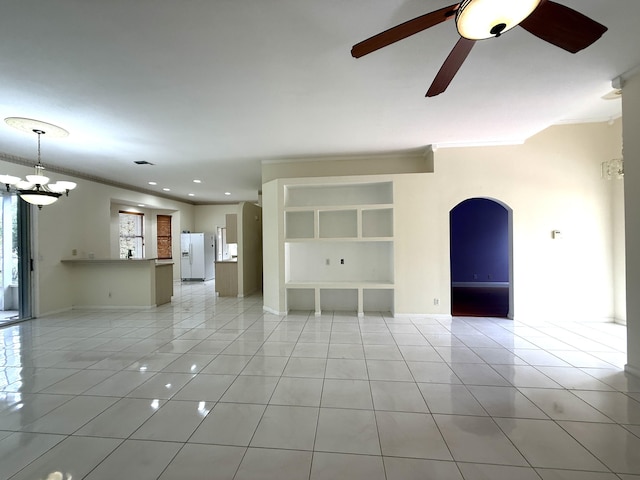 unfurnished living room with ceiling fan, light tile patterned floors, and ornamental molding