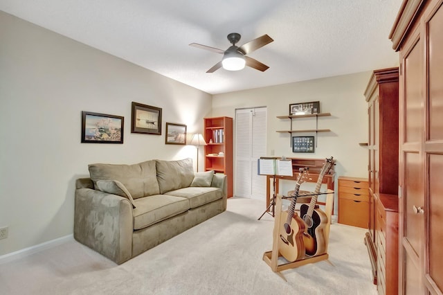 living room with light carpet and ceiling fan