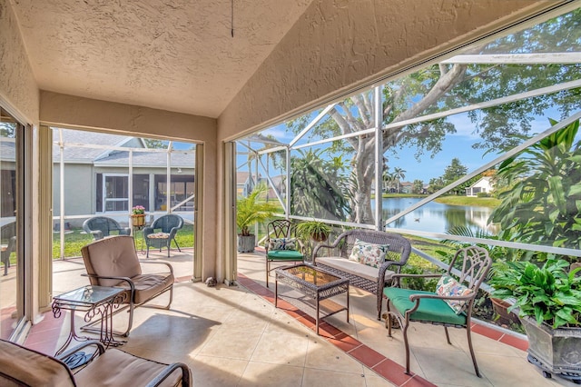 sunroom / solarium with a water view