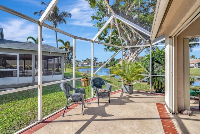 sunroom featuring a water view and plenty of natural light