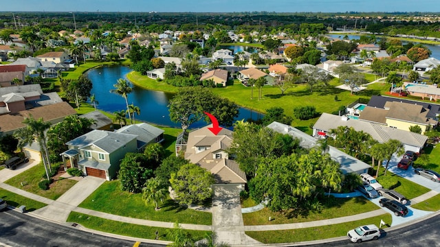 birds eye view of property featuring a water view