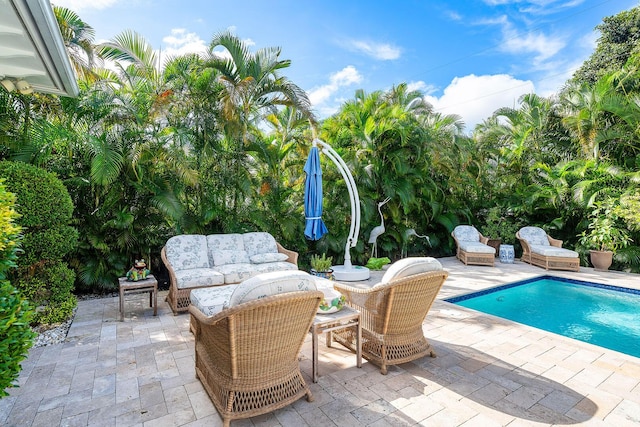 outdoor pool featuring a patio area