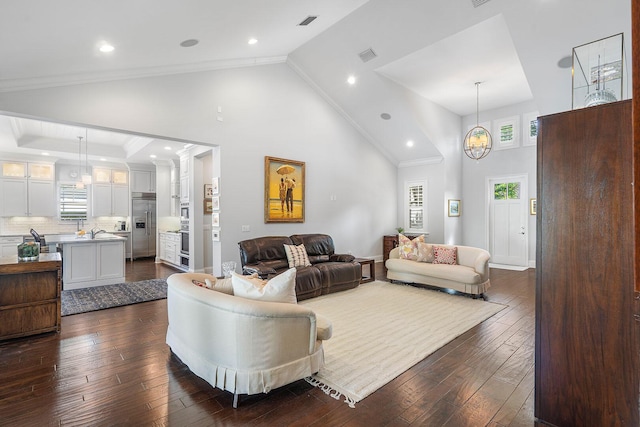 living room featuring dark wood-style flooring, crown molding, recessed lighting, visible vents, and high vaulted ceiling