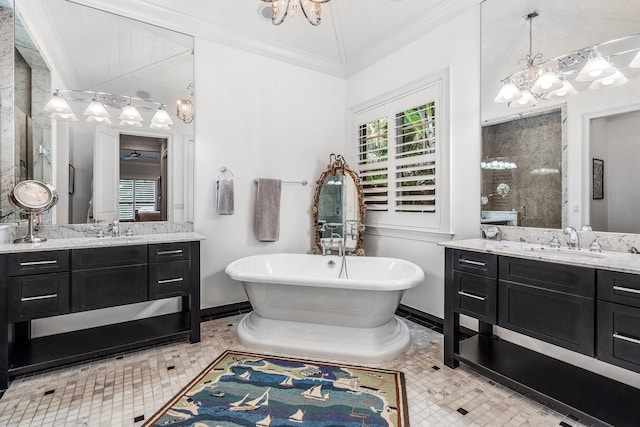 bathroom with vaulted ceiling, ornamental molding, two vanities, and a sink