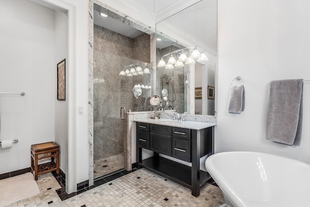 full bathroom with a freestanding bath, a shower stall, vanity, and baseboards