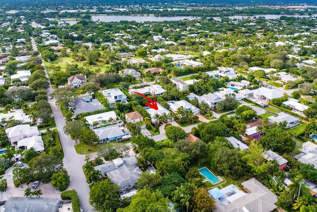 drone / aerial view featuring a residential view and a water view