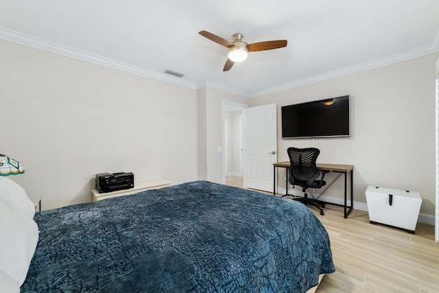 bedroom featuring ceiling fan, crown molding, and hardwood / wood-style flooring