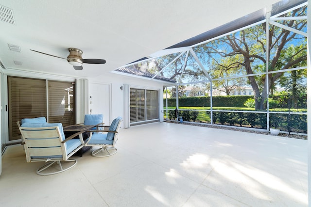 sunroom / solarium with ceiling fan