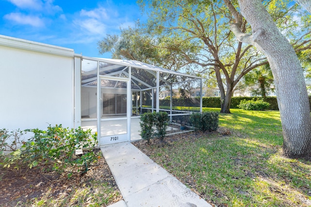 view of yard featuring glass enclosure