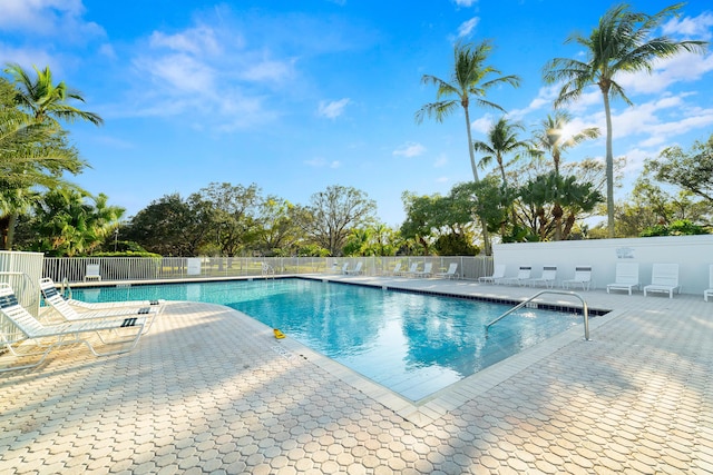 view of swimming pool with a patio area