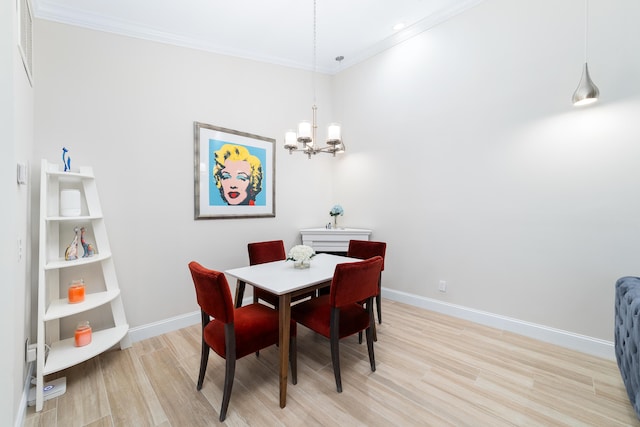 dining space featuring light hardwood / wood-style flooring, built in features, crown molding, and a notable chandelier