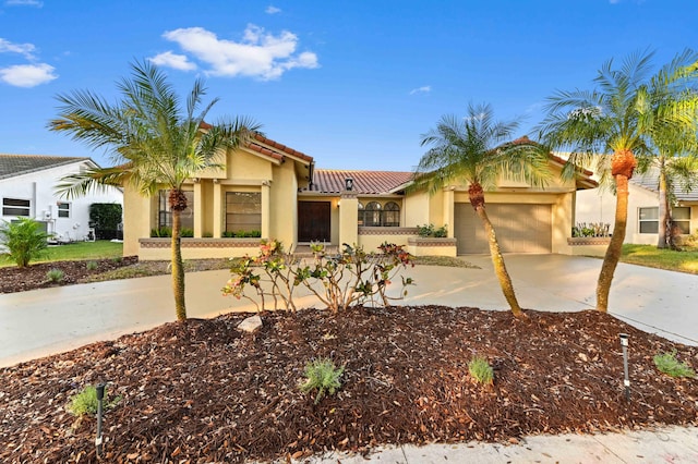 mediterranean / spanish-style house featuring a garage