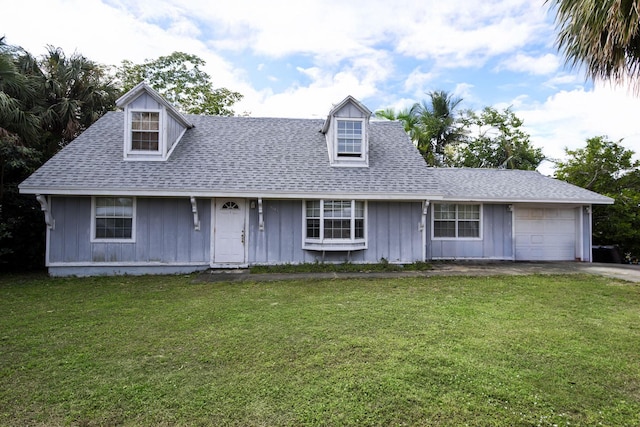 view of front facade featuring a front lawn and a garage