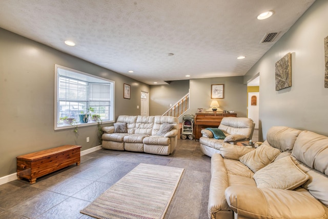 living room with a textured ceiling