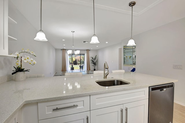 kitchen with dishwasher, pendant lighting, white cabinets, light stone counters, and sink