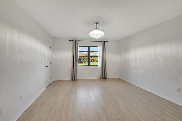 unfurnished room with light hardwood / wood-style floors