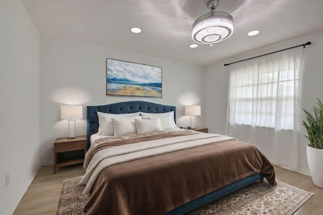 8315 Casa Del Lago Unit F, Boca Raton, FL 33433 - bedroom with light wood-style floors, a chandelier, and recessed lighting