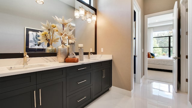 bathroom with tile patterned flooring and vanity