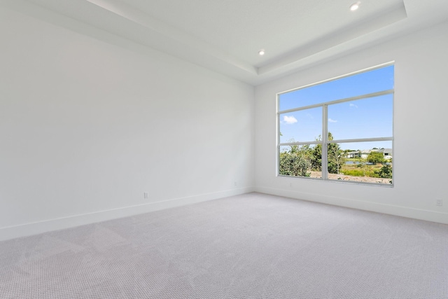 359 SE Via Sangro, Port Saint Lucie, FL 34952 - empty room with light colored carpet, baseboards, recessed lighting, and a tray ceiling