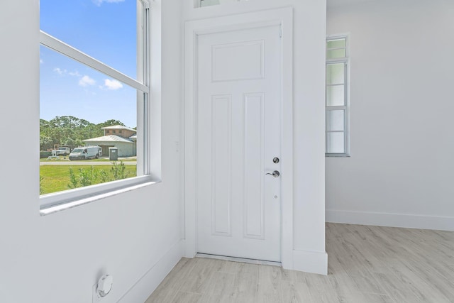 359 SE Via Sangro, Port Saint Lucie, FL 34952 - doorway with baseboards and wood finished floors