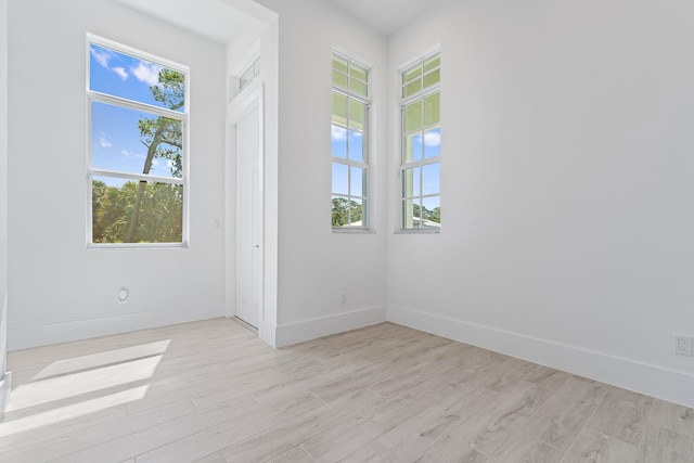 359 SE Via Sangro, Port Saint Lucie, FL 34952 - unfurnished room with light wood finished floors and baseboards