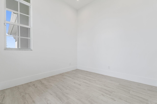 359 SE Via Sangro, Port Saint Lucie, FL 34952 - spare room featuring wood finished floors and baseboards