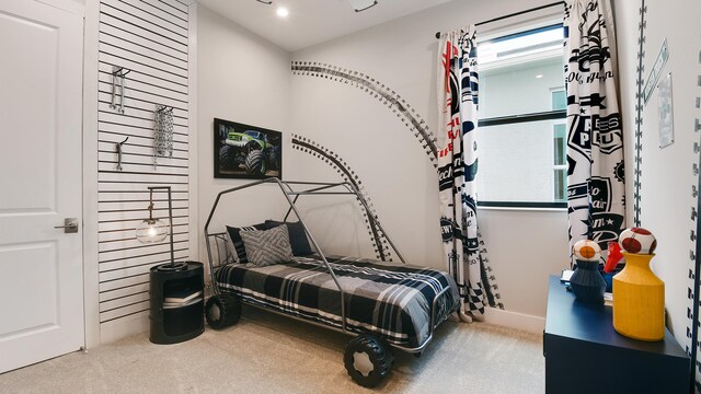 bedroom featuring carpet floors and multiple windows