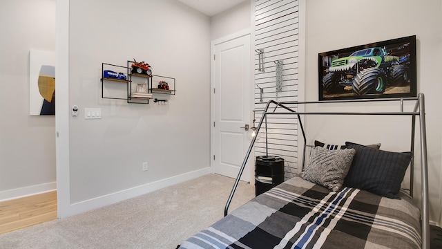 bedroom with light colored carpet