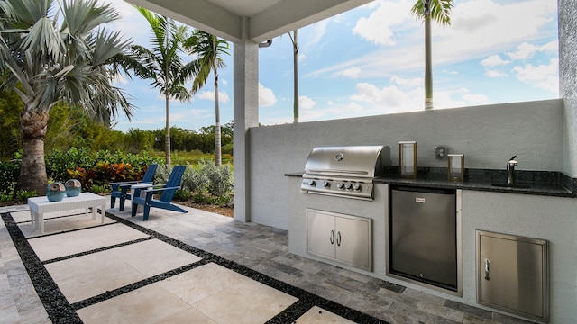 view of patio featuring grilling area, area for grilling, and sink