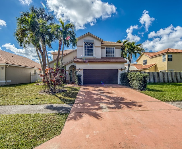 mediterranean / spanish-style house with a garage and a front lawn