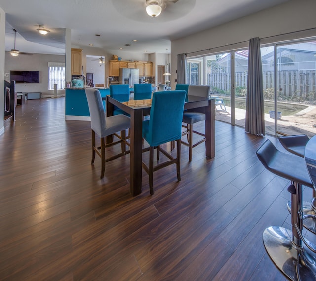 dining area featuring dark wood-style floors and ceiling fan