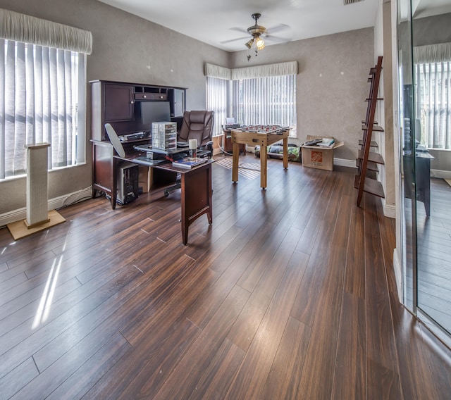 office space featuring dark wood-style floors, baseboards, and a ceiling fan