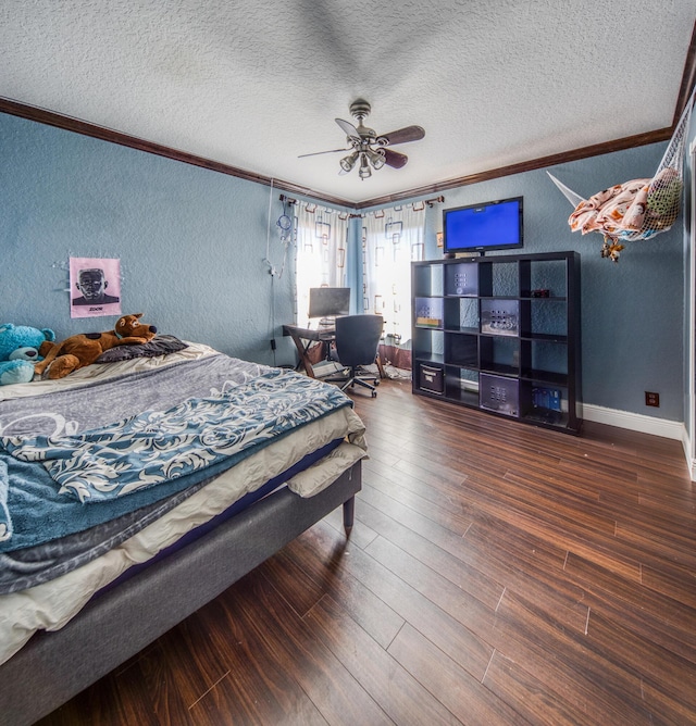 bedroom featuring a textured ceiling, dark wood-style flooring, crown molding, and a textured wall