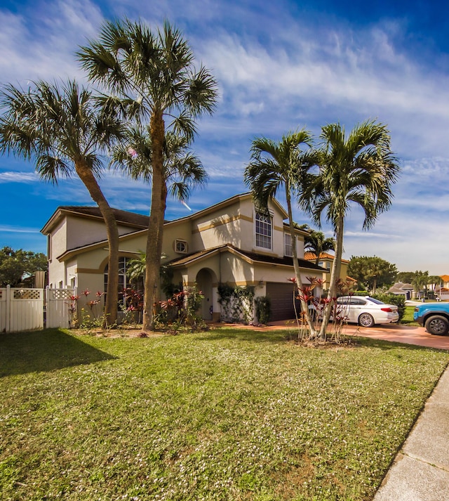 view of front facade with a garage and a front yard